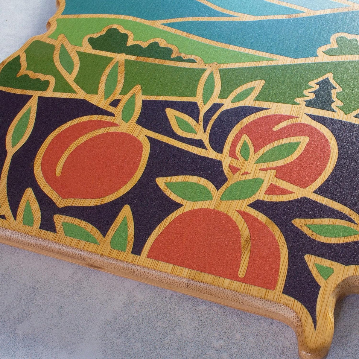 North Carolina State Shaped Cutting Board, Summer Stokes Art | State charcuterie board with colorful hand-drawn landscape art. Smooth reverse side for food prep. Hang tie for wall display. - Colors B