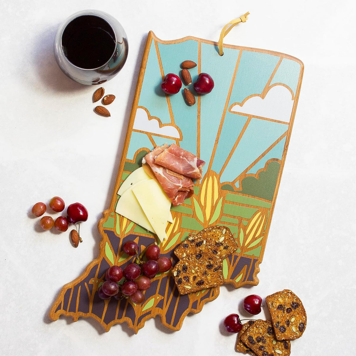 North Carolina State Shaped Cutting Board, Summer Stokes Art | State charcuterie board with colorful hand-drawn landscape art. Smooth reverse side for food prep. Hang tie for wall display. - Colors B