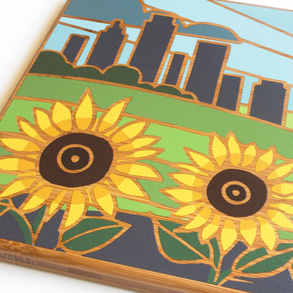 North Carolina State Shaped Cutting Board, Summer Stokes Art | State charcuterie board with colorful hand-drawn landscape art. Smooth reverse side for food prep. Hang tie for wall display. - Colors B