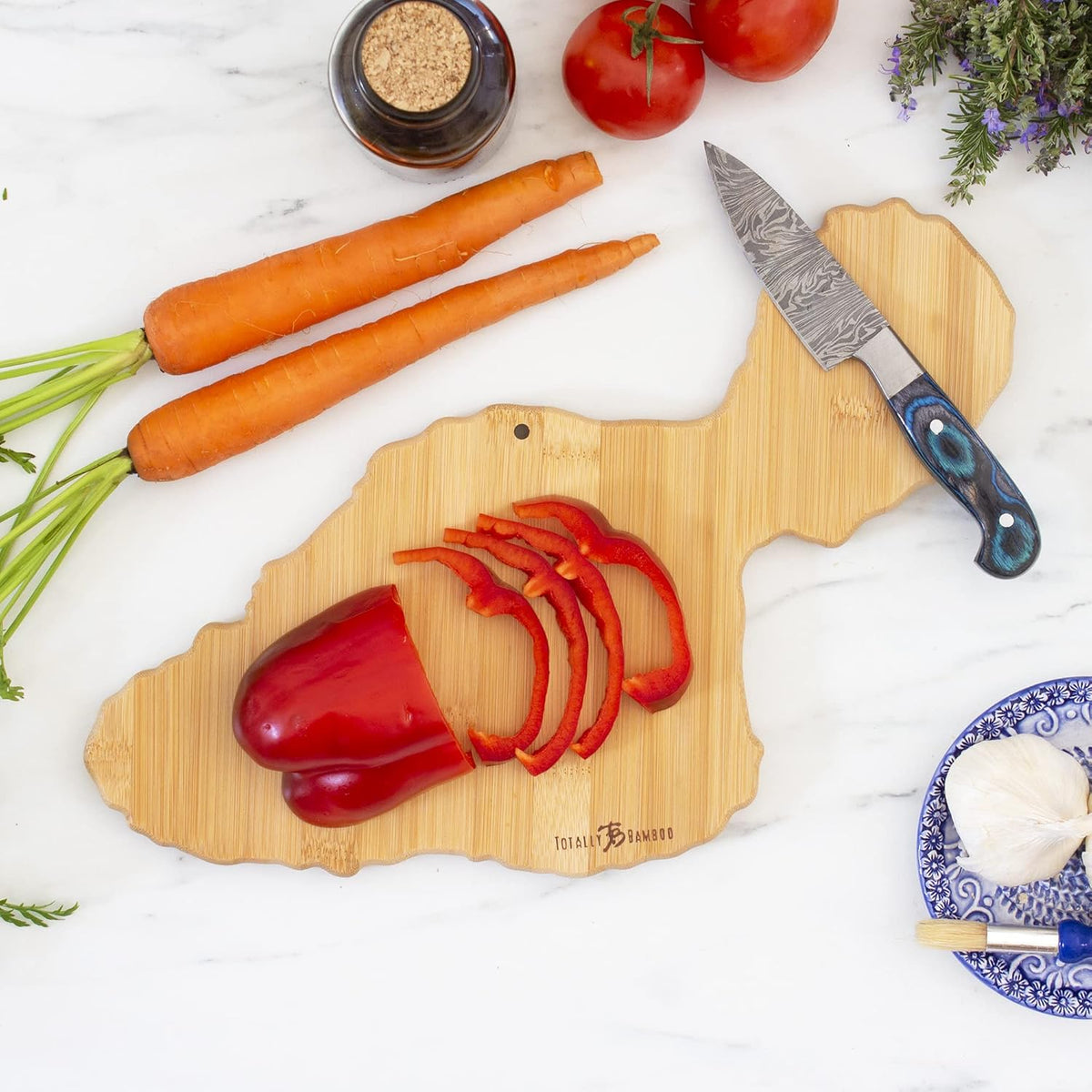 Destination Maui Serving and Cutting Board, Includes Hang Tie for Wall Display | Maui charcuterie serving board with engraved map artwork. Smooth reverse side for food prep. Hang tie for wall display.