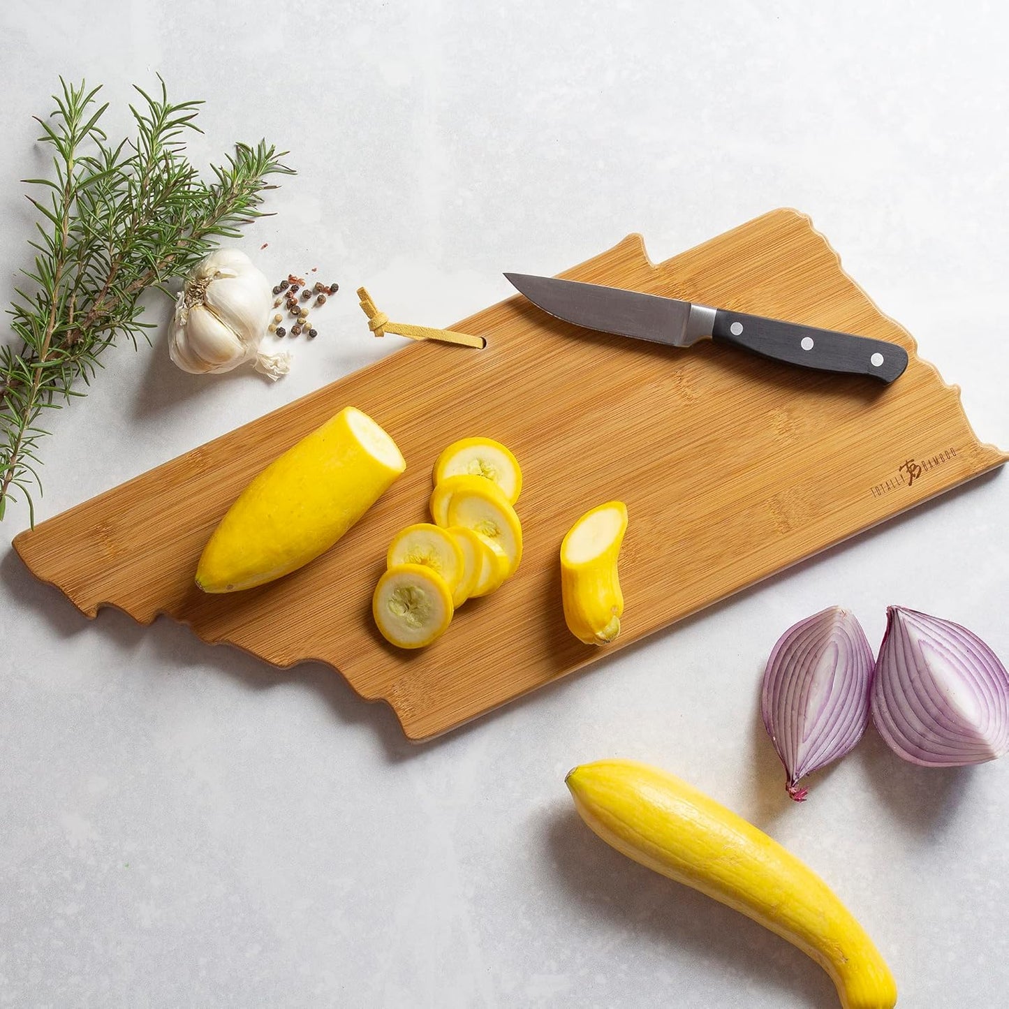 Tennessee State Shaped Cutting Board, Art by Fish Kiss | State charcuterie board with colorful hand-drawn map artwork. Smooth reverse side for food prep. Hang tie for wall display. - Colors B