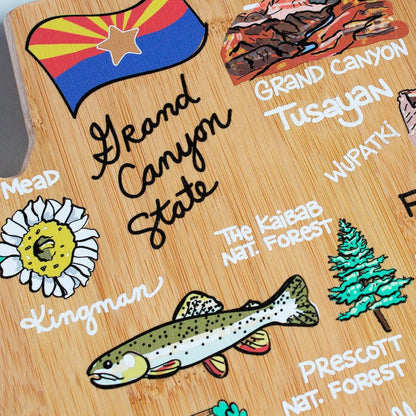 Tennessee State Shaped Cutting Board, Art by Fish Kiss | State charcuterie board with colorful hand-drawn map artwork. Smooth reverse side for food prep. Hang tie for wall display. - Colors B