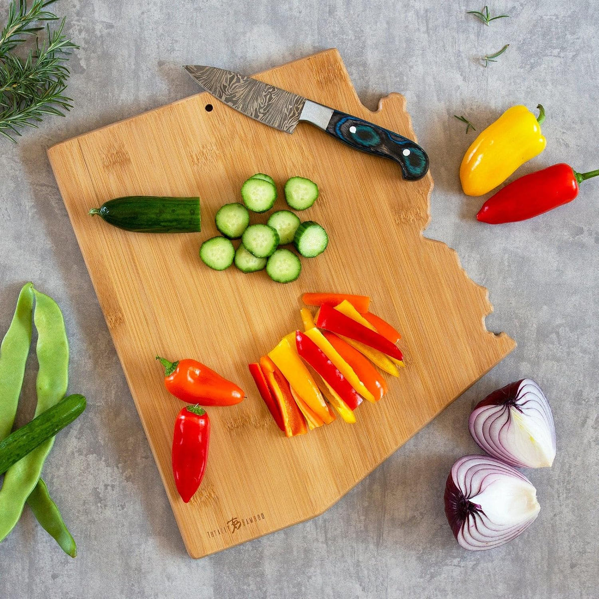 Tennessee State Shaped Cutting Board, Art by Fish Kiss | State charcuterie board with colorful hand-drawn map artwork. Smooth reverse side for food prep. Hang tie for wall display. - Colors B