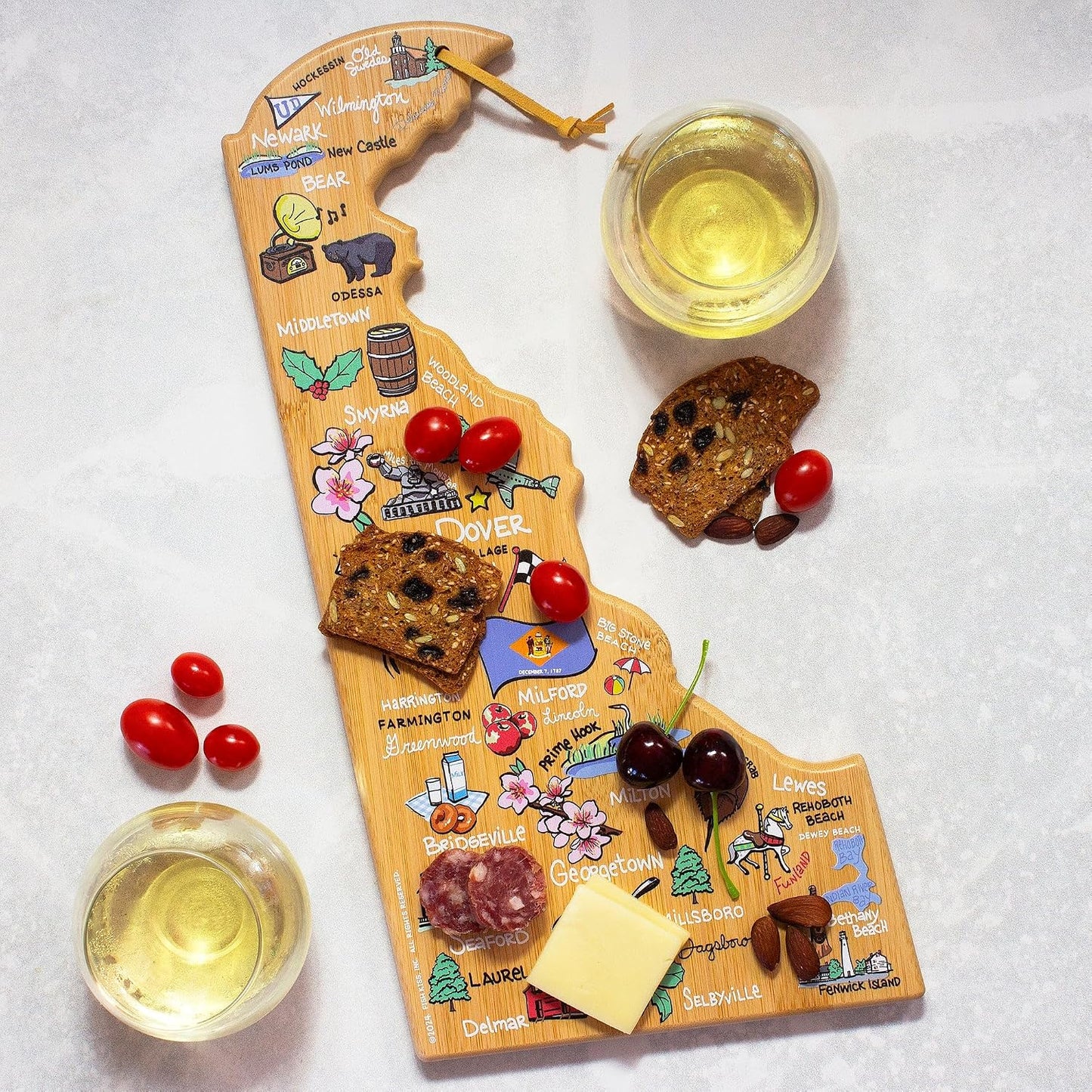 Tennessee State Shaped Cutting Board, Art by Fish Kiss | State charcuterie board with colorful hand-drawn map artwork. Smooth reverse side for food prep. Hang tie for wall display. - Colors B