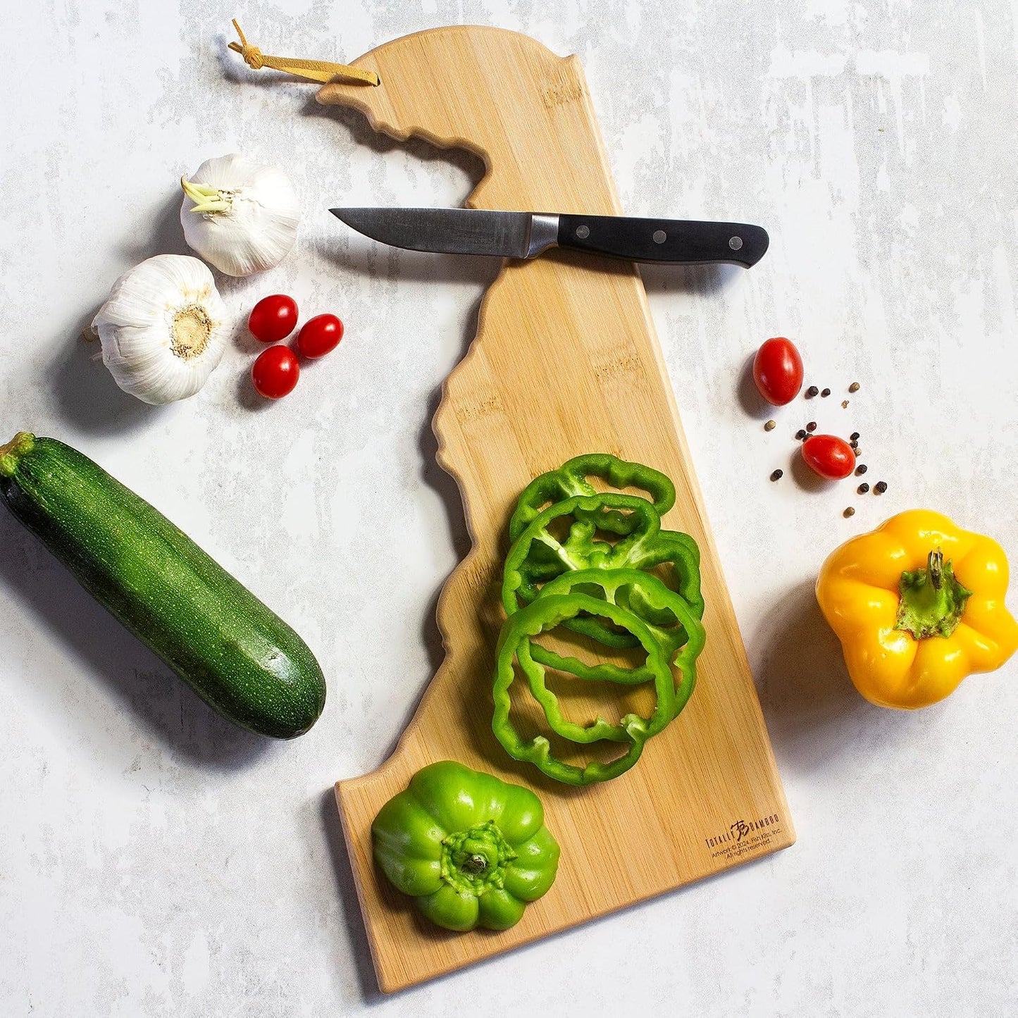 Tennessee State Shaped Cutting Board, Art by Fish Kiss | State charcuterie board with colorful hand-drawn map artwork. Smooth reverse side for food prep. Hang tie for wall display. - Colors B