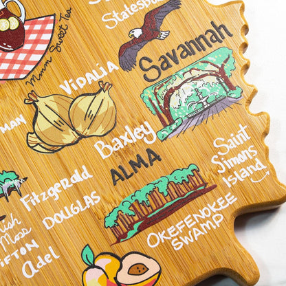 Tennessee State Shaped Cutting Board, Art by Fish Kiss | State charcuterie board with colorful hand-drawn map artwork. Smooth reverse side for food prep. Hang tie for wall display. - Colors B