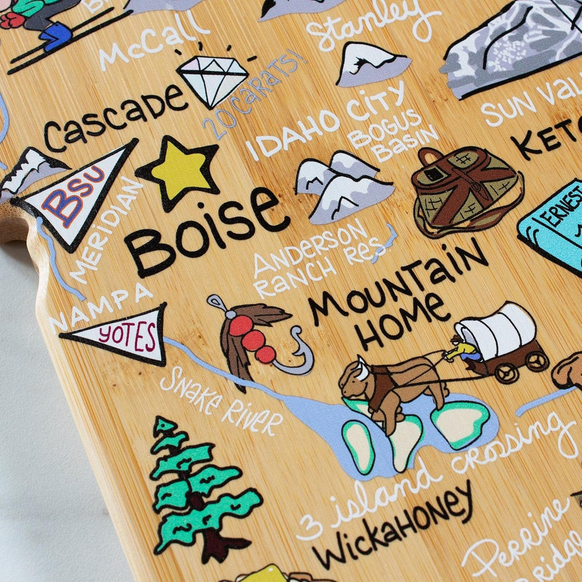 Tennessee State Shaped Cutting Board, Art by Fish Kiss | State charcuterie board with colorful hand-drawn map artwork. Smooth reverse side for food prep. Hang tie for wall display. - Colors B