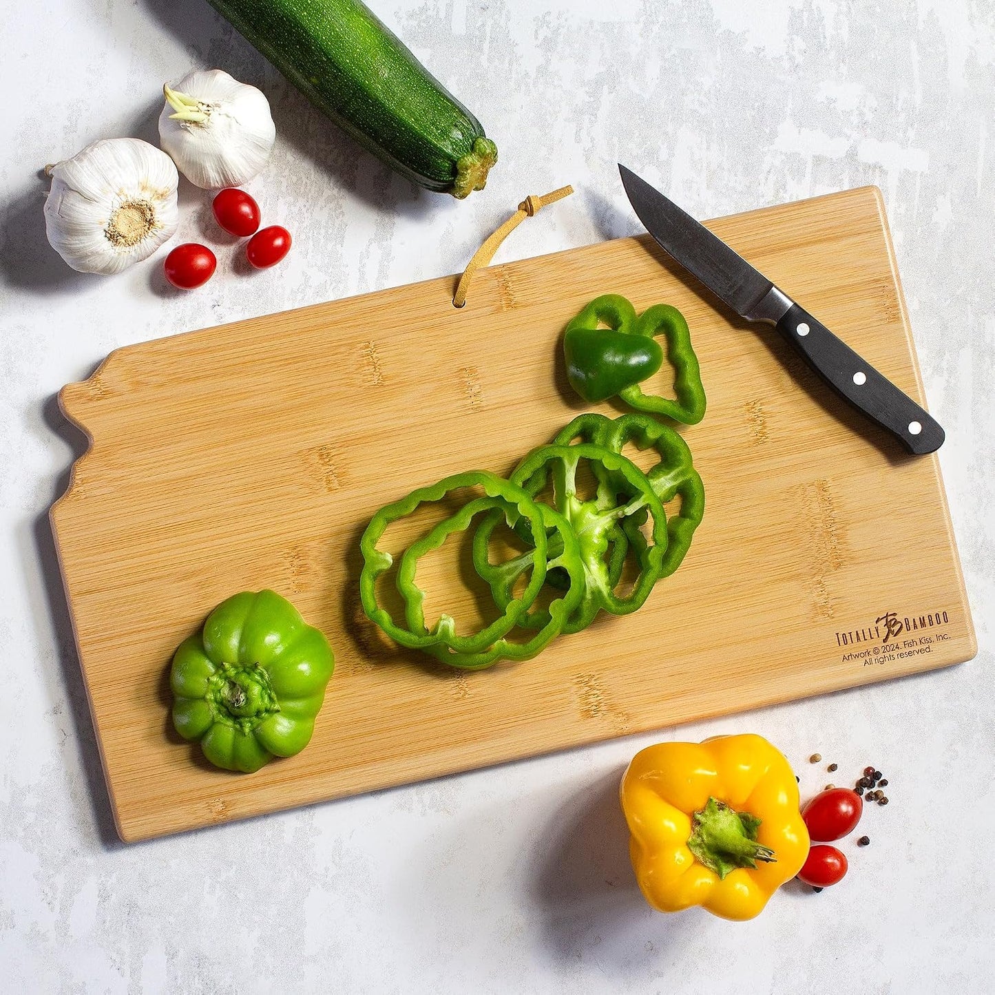 Tennessee State Shaped Cutting Board, Art by Fish Kiss | State charcuterie board with colorful hand-drawn map artwork. Smooth reverse side for food prep. Hang tie for wall display. - Colors B