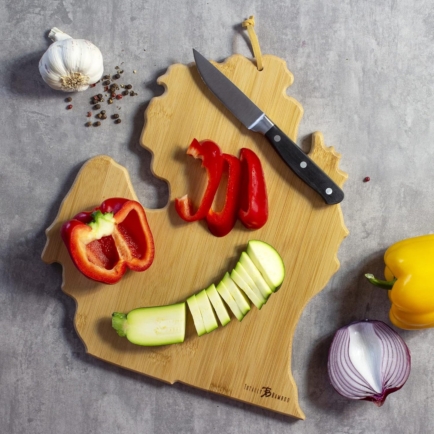 Tennessee State Shaped Cutting Board, Art by Fish Kiss | State charcuterie board with colorful hand-drawn map artwork. Smooth reverse side for food prep. Hang tie for wall display. - Colors B