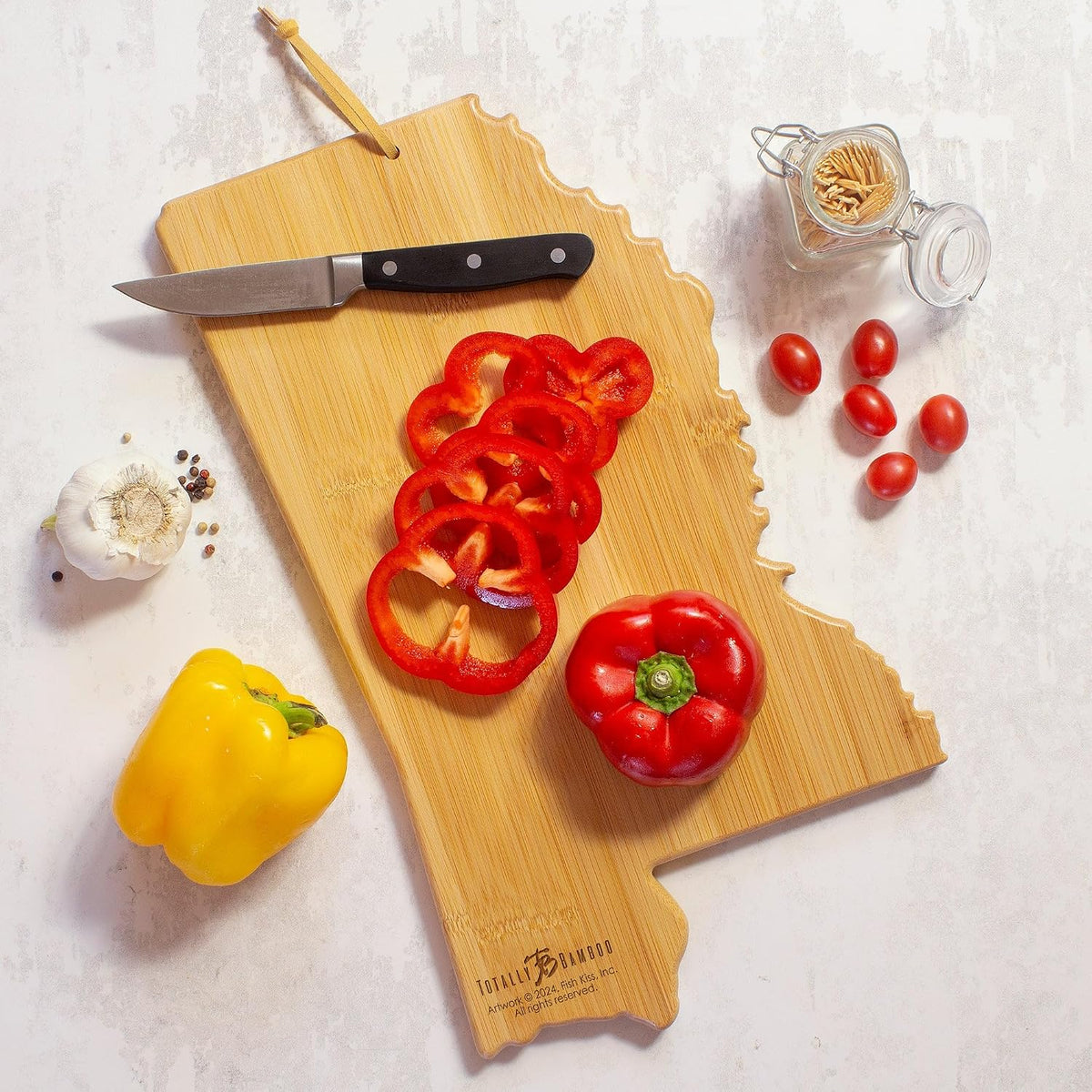 Tennessee State Shaped Cutting Board, Art by Fish Kiss | State charcuterie board with colorful hand-drawn map artwork. Smooth reverse side for food prep. Hang tie for wall display. - Colors B
