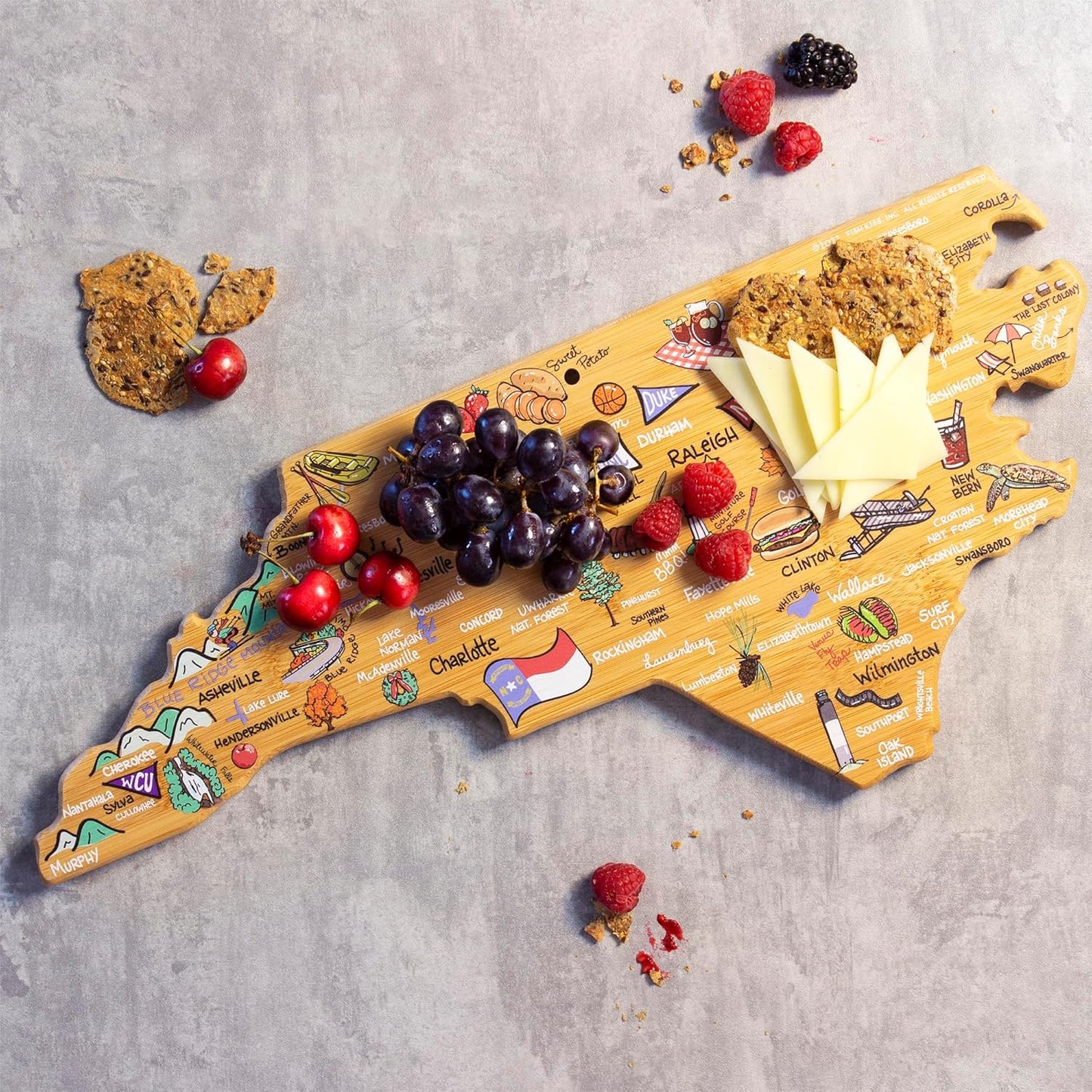 Tennessee State Shaped Cutting Board, Art by Fish Kiss | State charcuterie board with colorful hand-drawn map artwork. Smooth reverse side for food prep. Hang tie for wall display. - Colors B