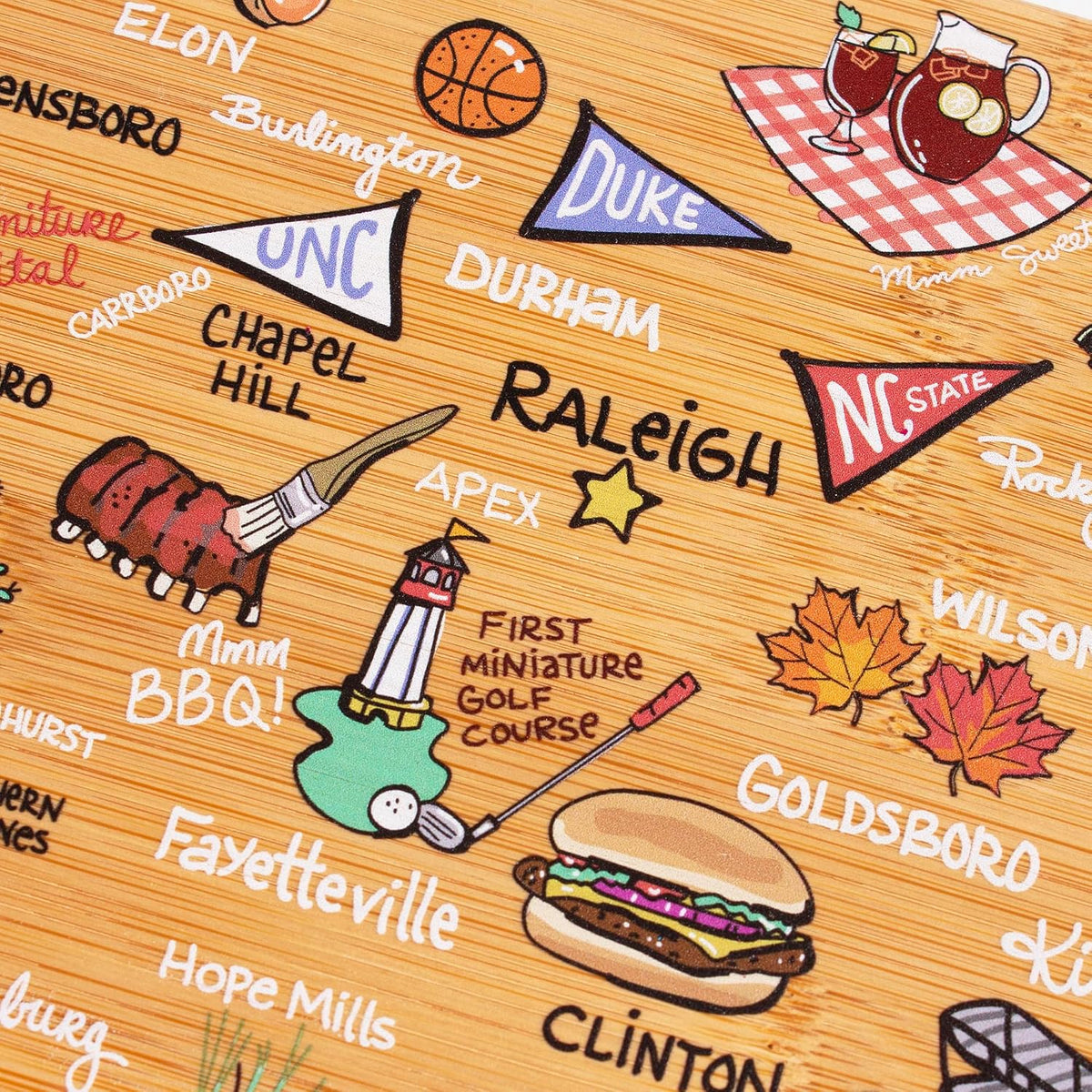 Tennessee State Shaped Cutting Board, Art by Fish Kiss | State charcuterie board with colorful hand-drawn map artwork. Smooth reverse side for food prep. Hang tie for wall display. - Colors B