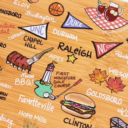 Tennessee State Shaped Cutting Board, Art by Fish Kiss | State charcuterie board with colorful hand-drawn map artwork. Smooth reverse side for food prep. Hang tie for wall display. - Colors B