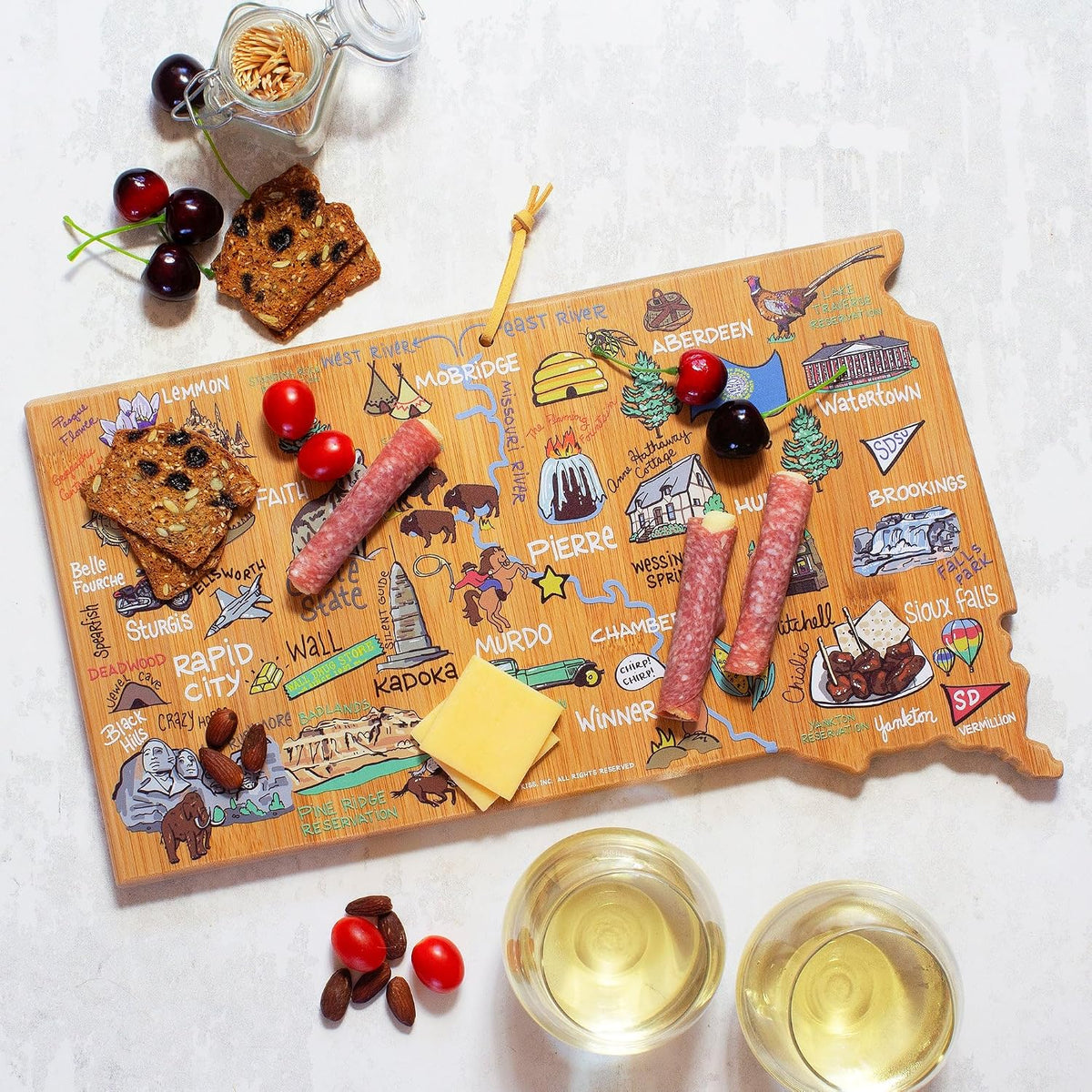 Tennessee State Shaped Cutting Board, Art by Fish Kiss | State charcuterie board with colorful hand-drawn map artwork. Smooth reverse side for food prep. Hang tie for wall display. - Colors B