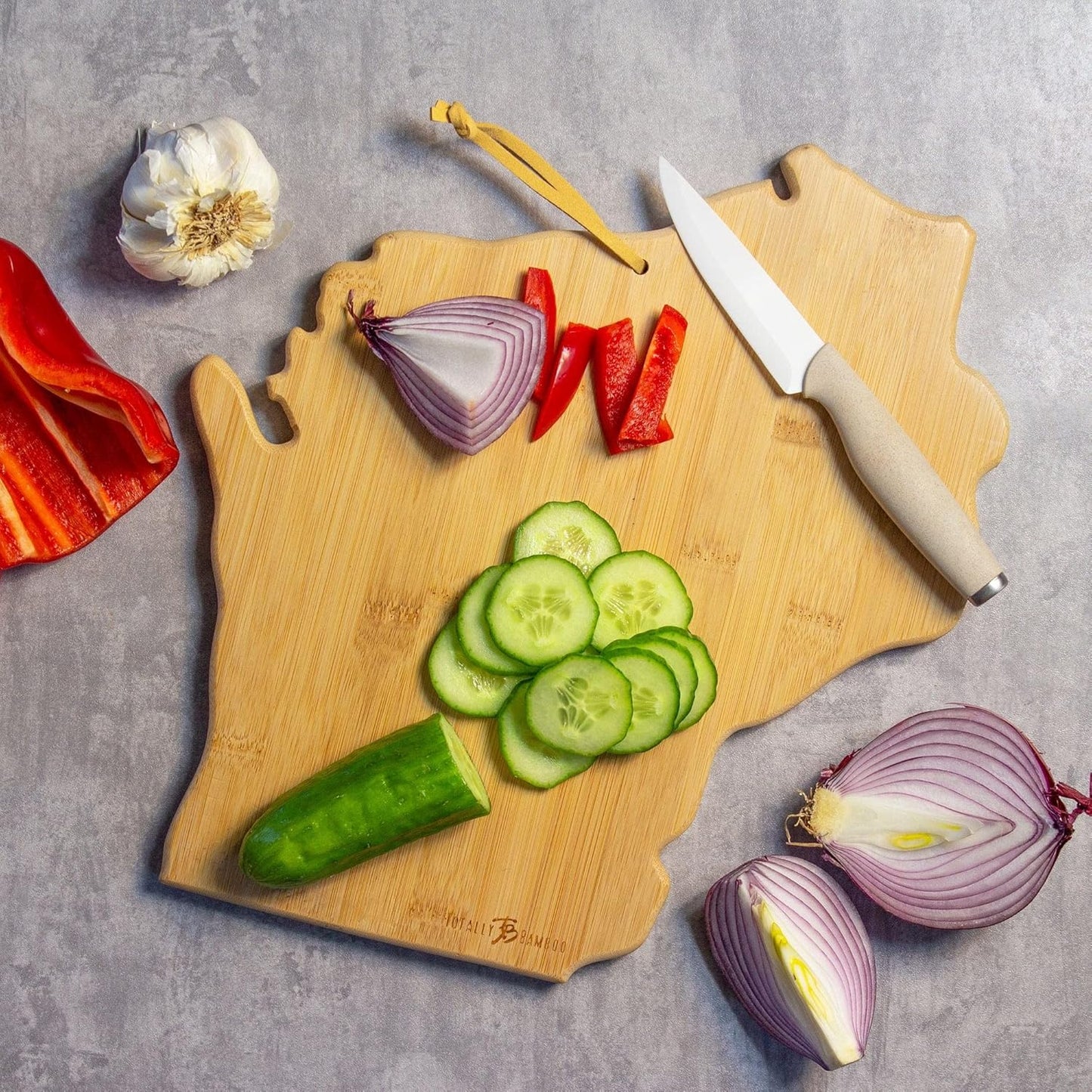 Tennessee State Shaped Cutting Board, Art by Fish Kiss | State charcuterie board with colorful hand-drawn map artwork. Smooth reverse side for food prep. Hang tie for wall display. - Colors B