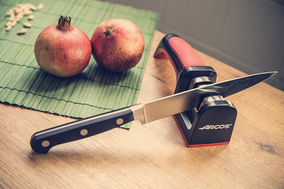Sharpeners Manual Knife Sharpener tool. Made of ABS + TPE. Carbide and Ceramic Rollers. Keep Your Knives Razor Sharp. Black and Red Color