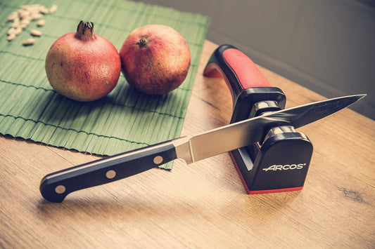 Sharpeners Manual Knife Sharpener tool. Made of ABS + TPE. Carbide and Ceramic Rollers. Keep Your Knives Razor Sharp. Black and Red Color