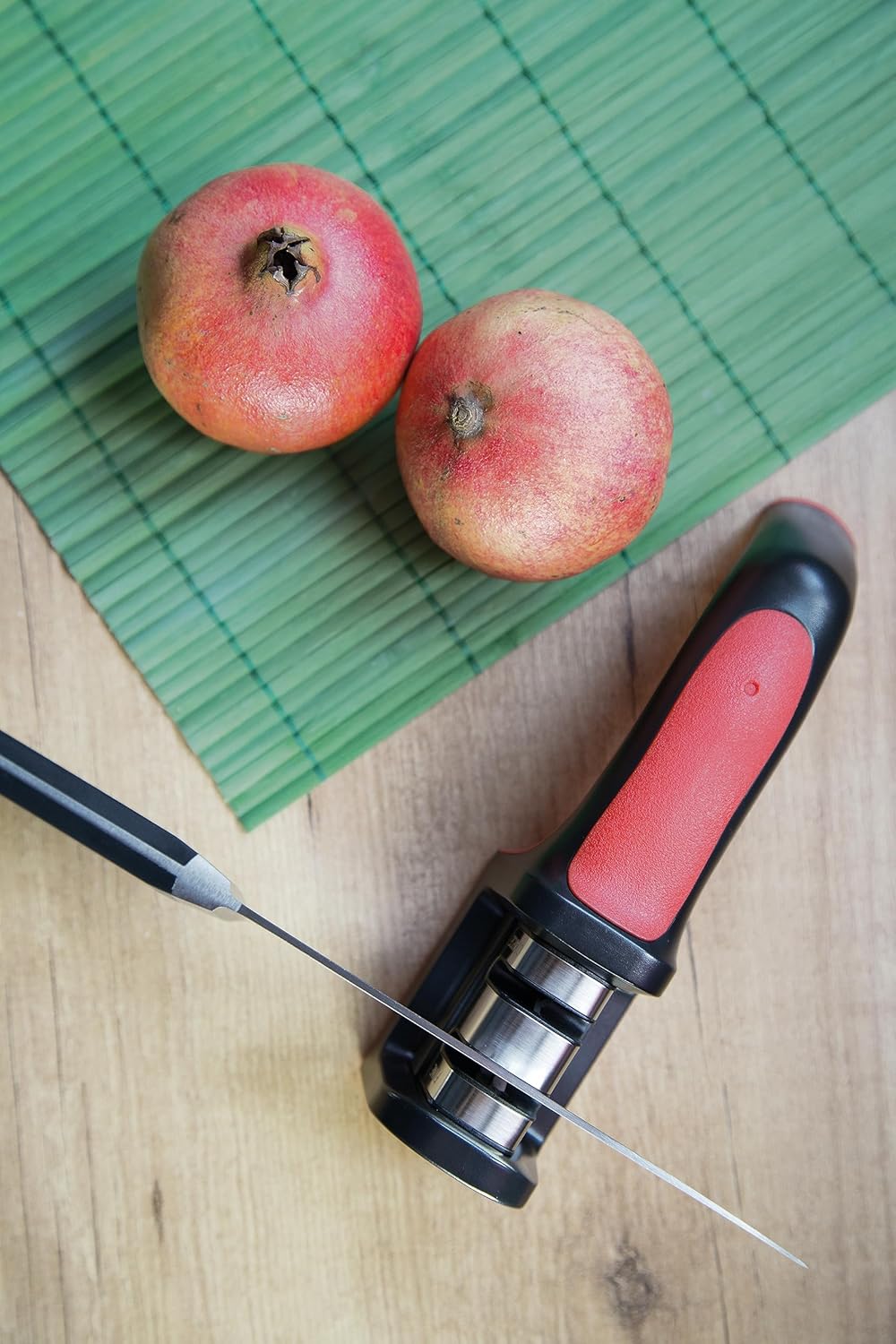 Sharpeners Manual Knife Sharpener tool. Made of ABS + TPE. Carbide and Ceramic Rollers. Keep Your Knives Razor Sharp. Black and Red Color