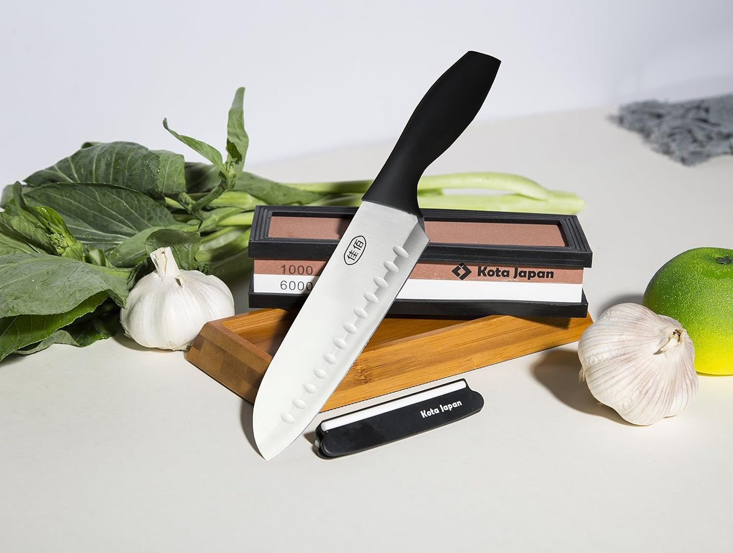 1000-grit Coarse Side and 6000-grit Polishing Side Knife Sharpening Whetstone with Bamboo Base and Blade Guide | Dual-sided design combines coarse sharpening and fine polishing in one stone. Complete kit for home knife maintenance.