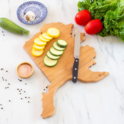 Destination Alaska State Shaped Cutting Board | State charcuterie serving board with engraved map artwork. Smooth reverse side for food prep. Hang tie for wall display.